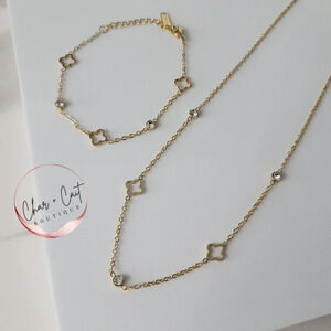 Gold-tone Clover Necklace and Bracelet Set with Crystal Accents